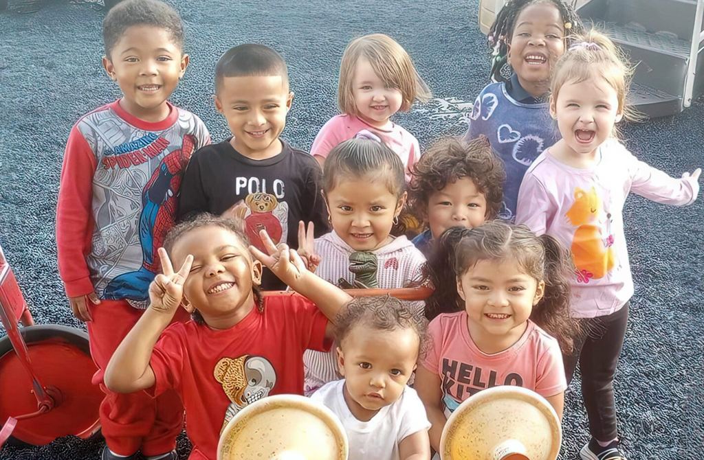 Smiling pre-K children outside at A Child's Galaxy Preschool